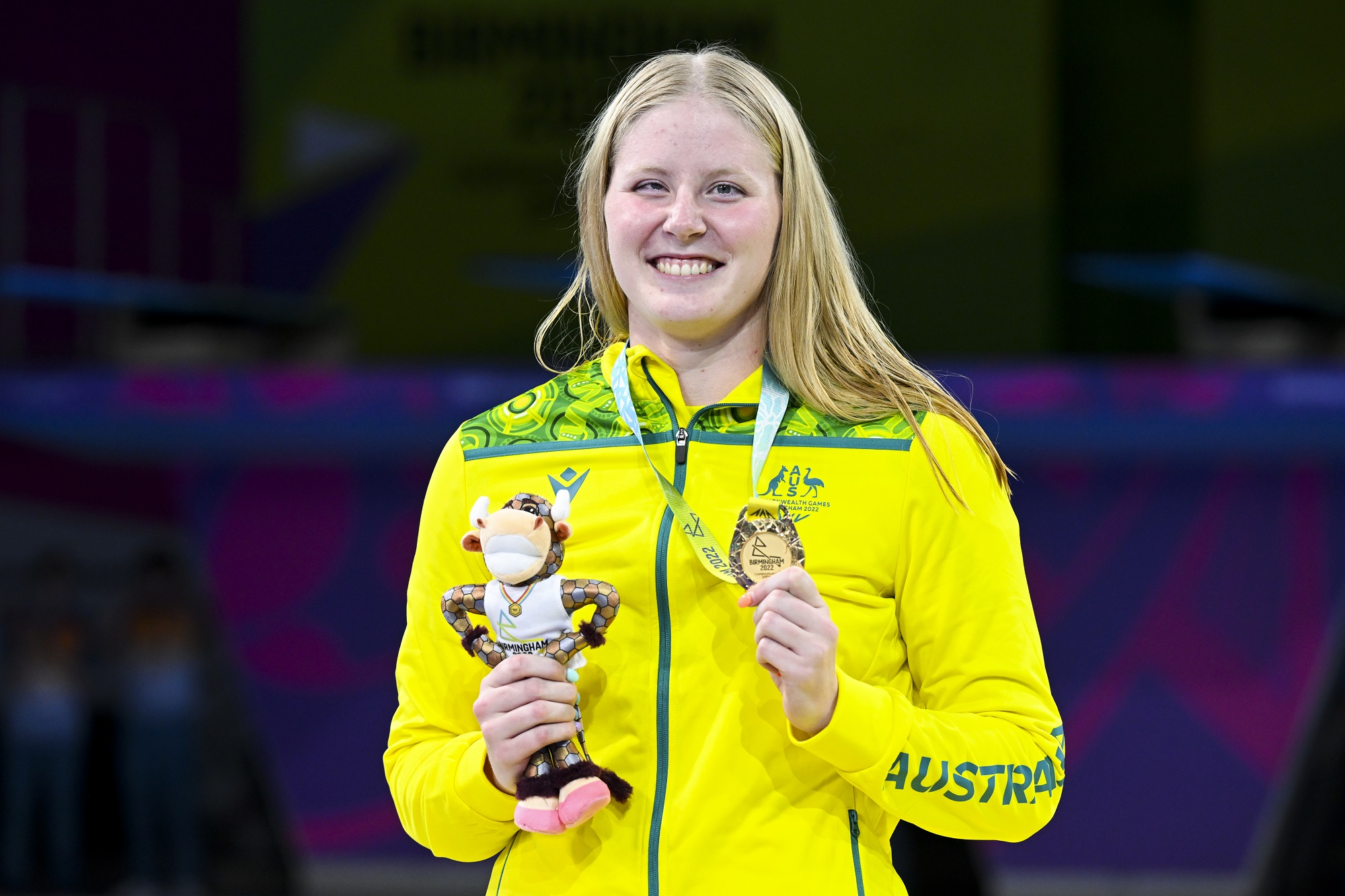 Katja Dedekind of Australia holds the gold medal she won in the Women's 50m Freestyle S13 Final on Day 2 of the Commonwealth Games. 