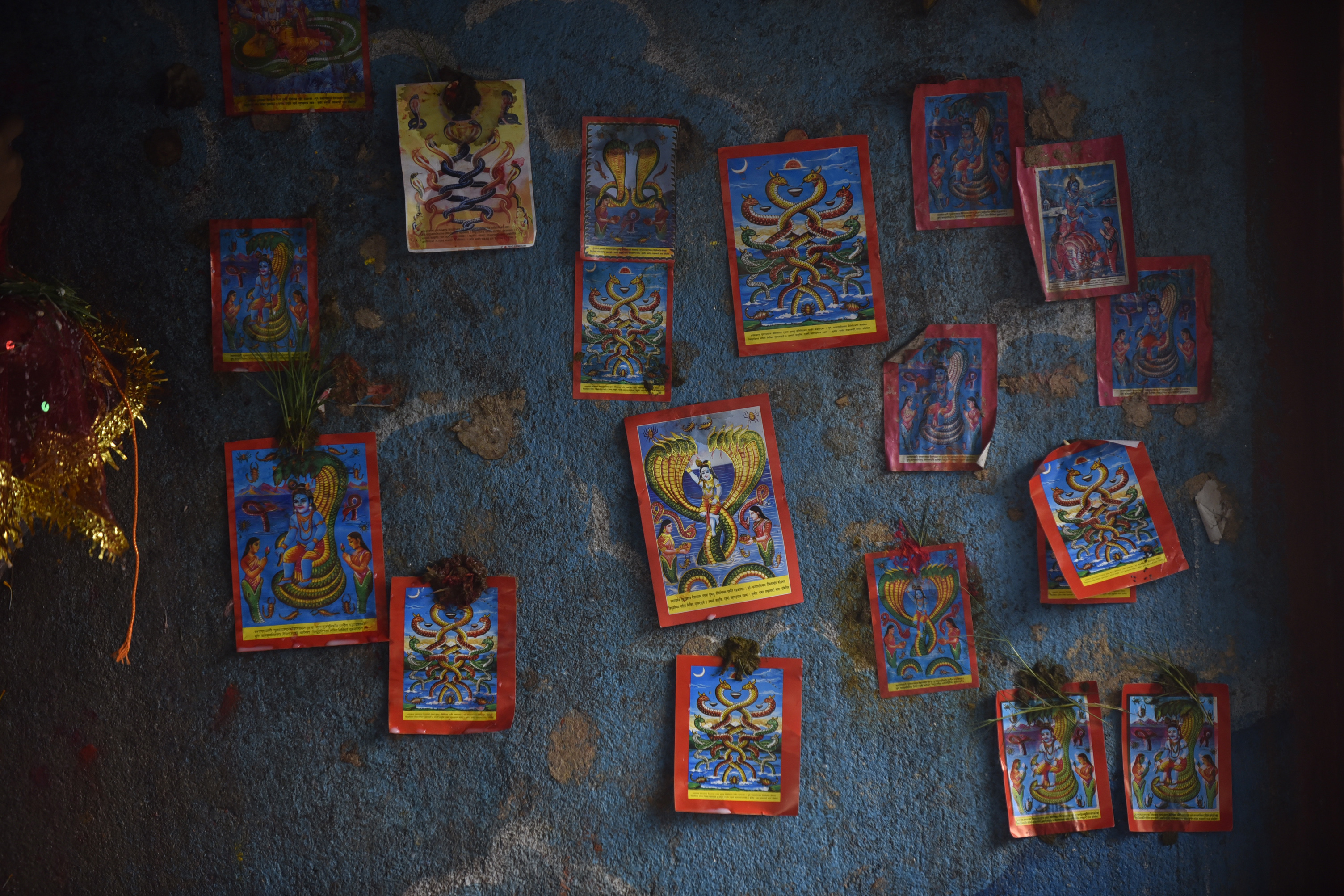 The wall of a temple seen with Naga posters during Nag Panchami celebration at Naxal, Kathmandu.