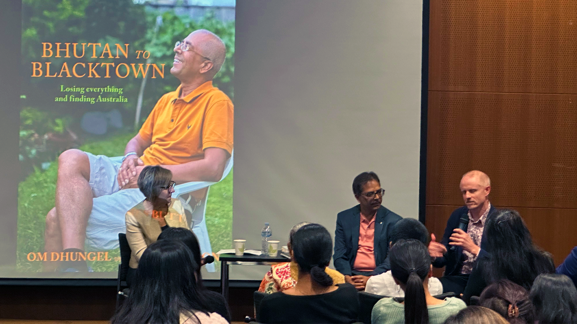 Om Dhungel (C) launched his autobiography "Bhutan to Blacktown - Losing Everything and Finding Australia" written contributions from journalist James Button (R).