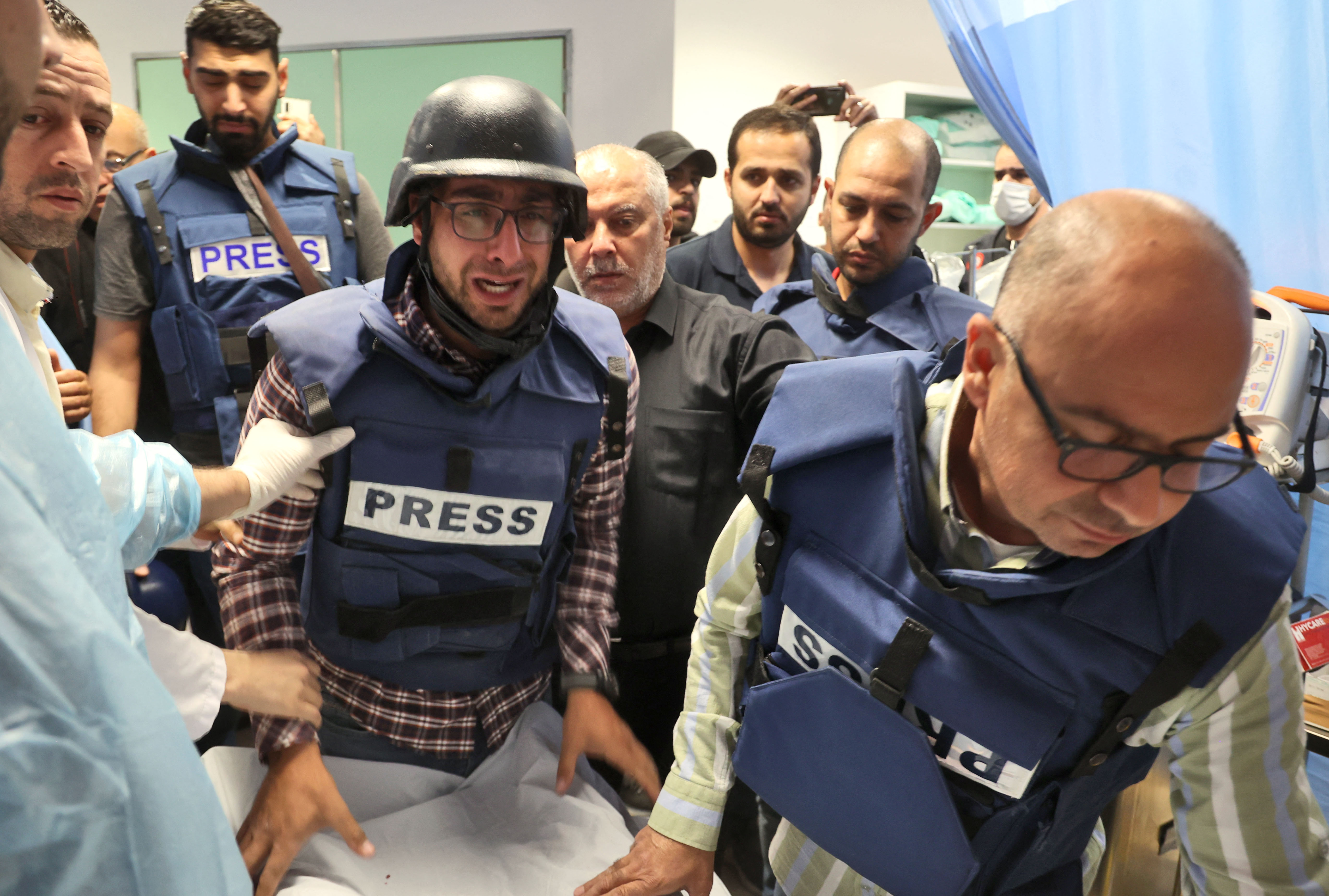 Press gather in distress over the body of Shireen.