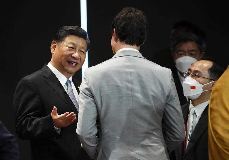 Xi Jinping and Justin Trudeau have a brief conversation at the G20 summit