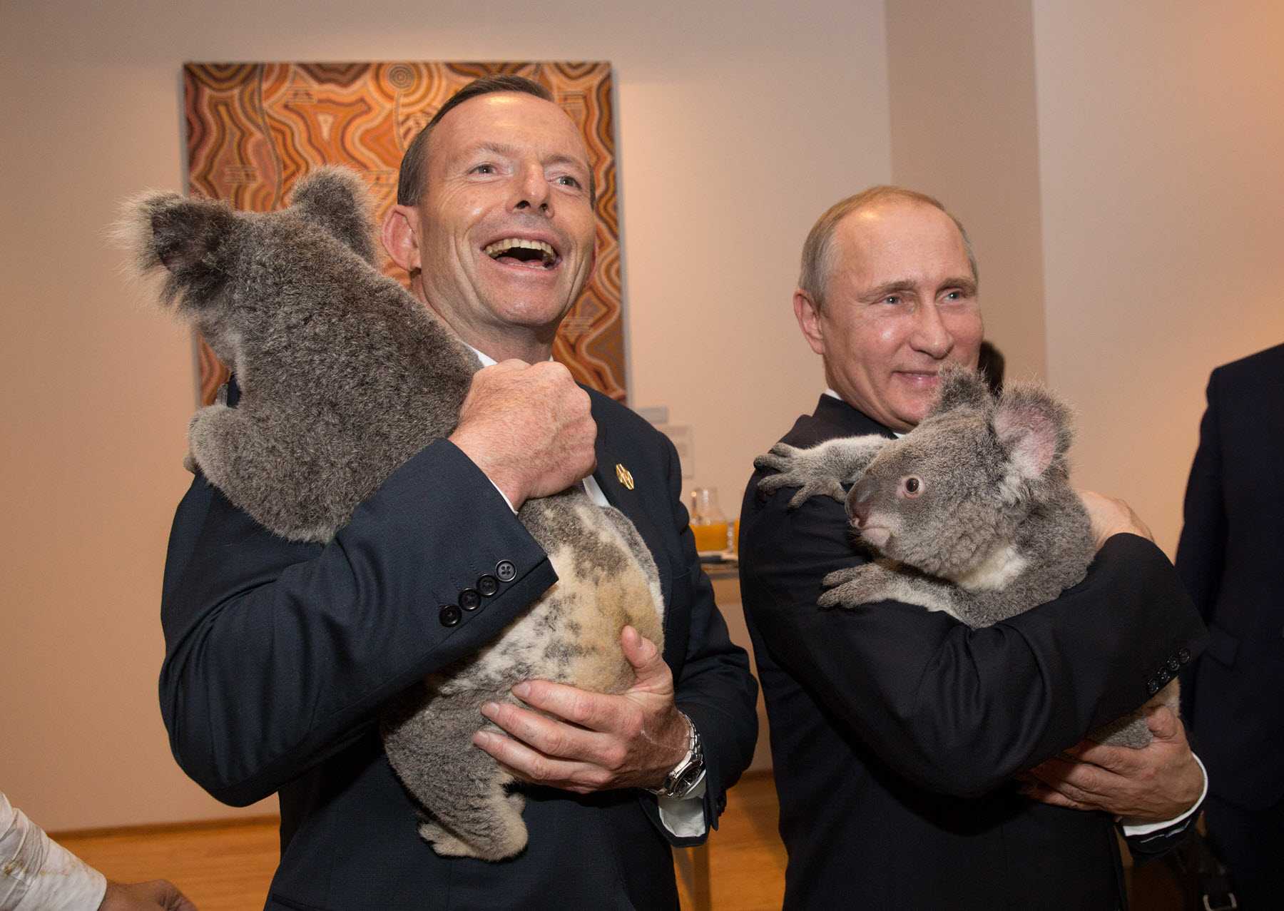 Former Australian Prime Minister Tony Abbott and Russia's Vladimir Putin (AAP)