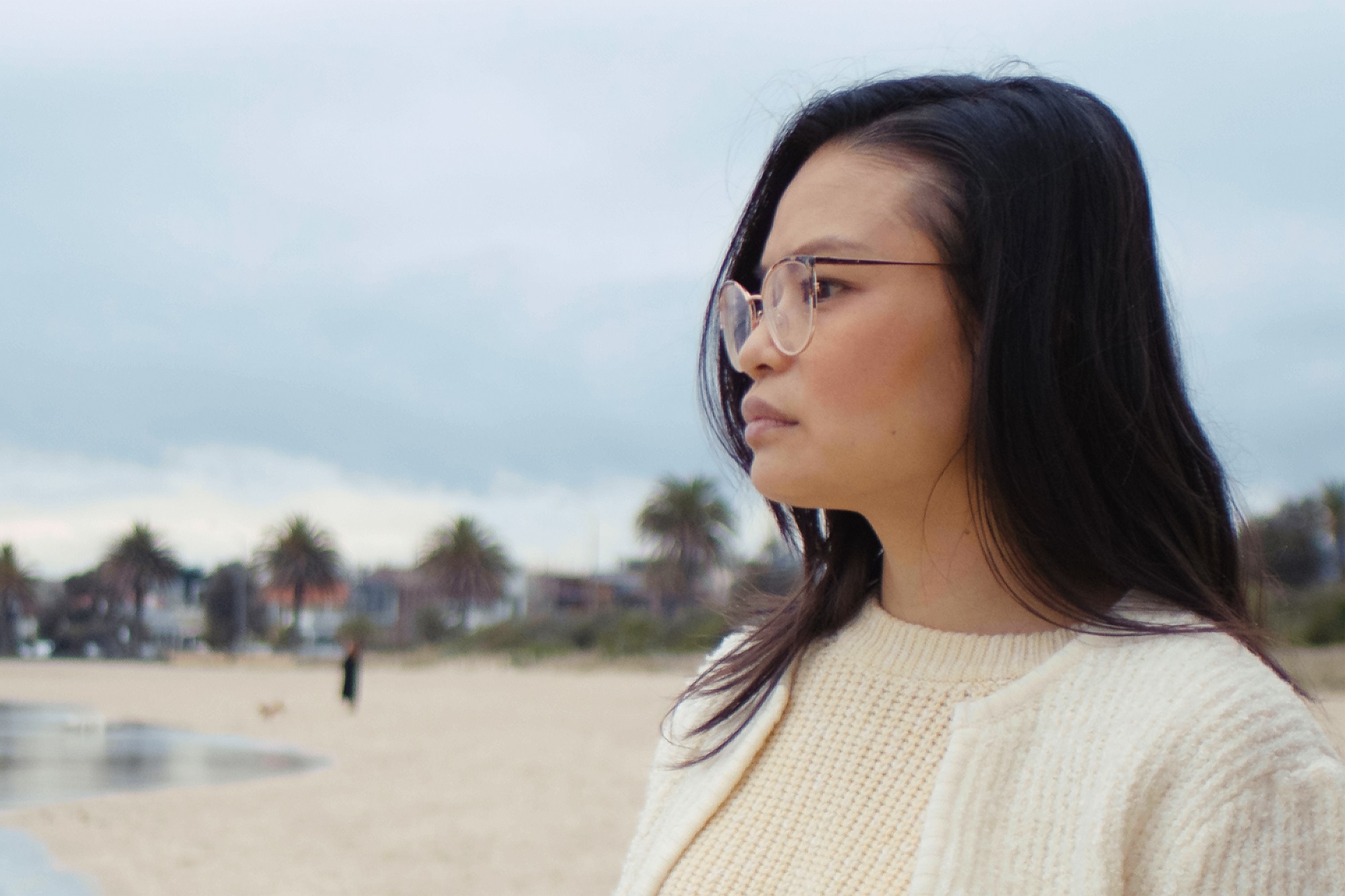 Thu Fampidi is seen from the side profile as she looks into the distance at the beach.