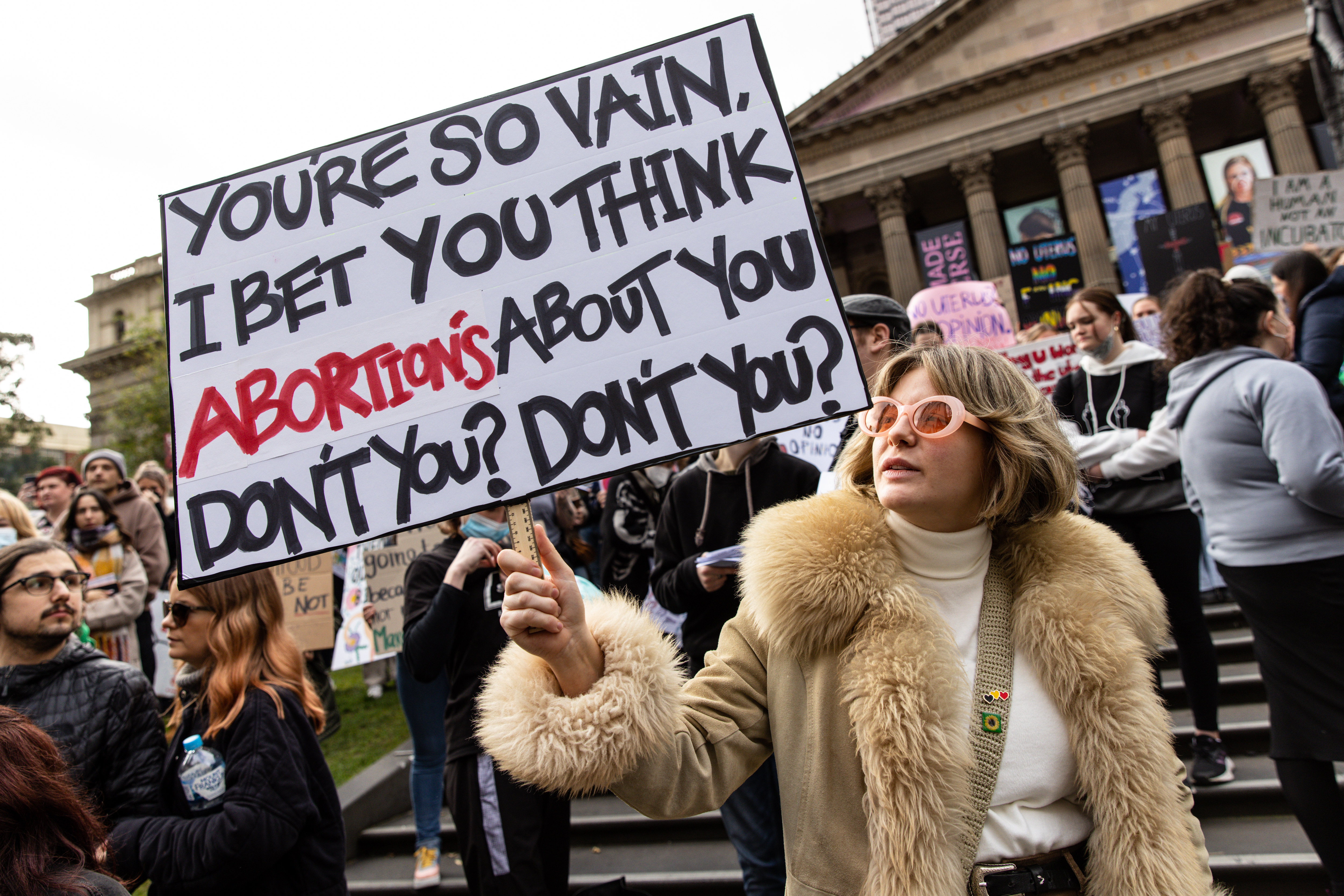 Demonstrators hold placards and signs during a rally in support of abortion rights at the State Library of Victoria in Melbourne on Saturday.