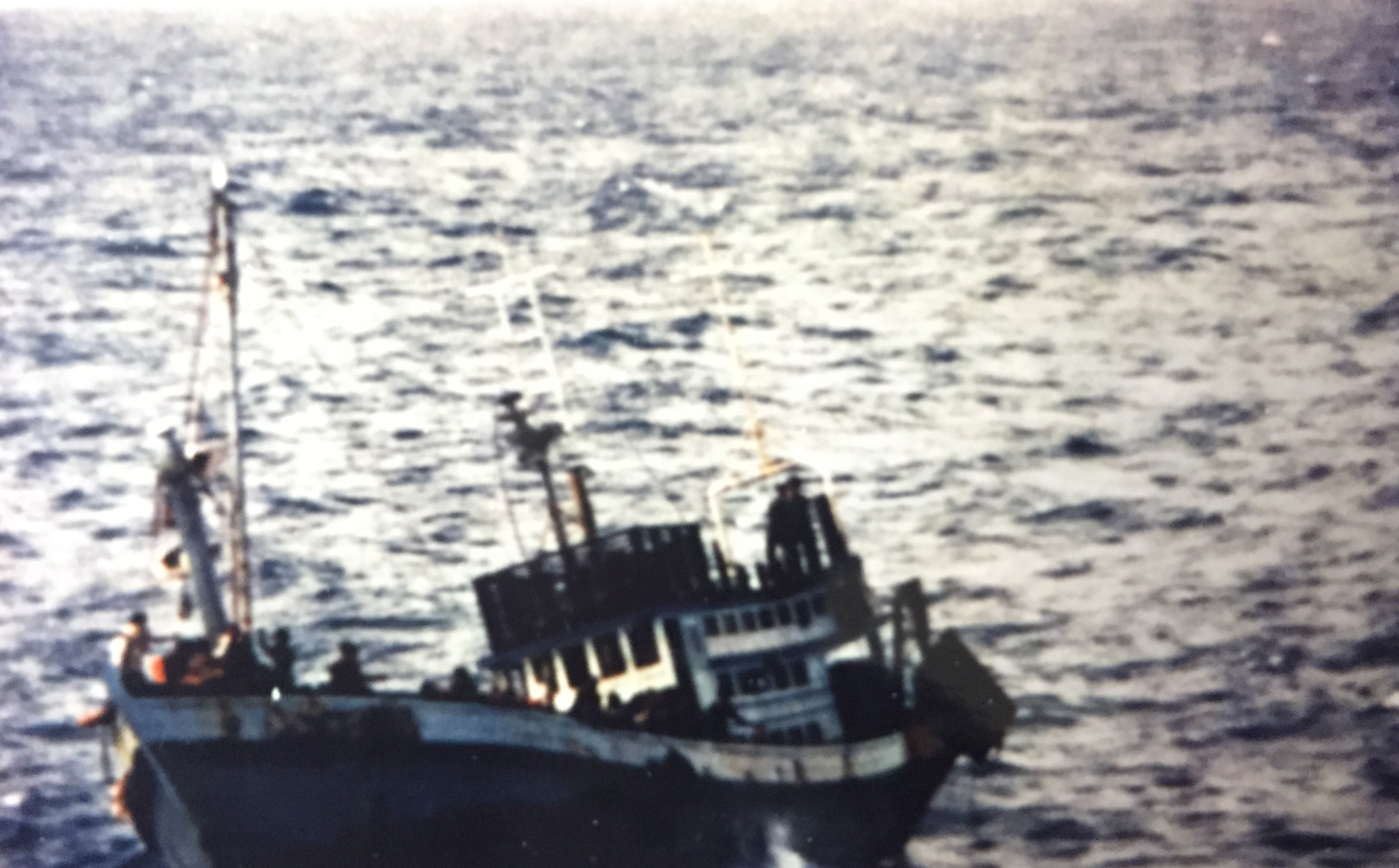 Vietnamese refugees, including my uncle John, on board a sinking boat belonging to the Thai pirates that attacked them. (Lin Taylor/SBS)