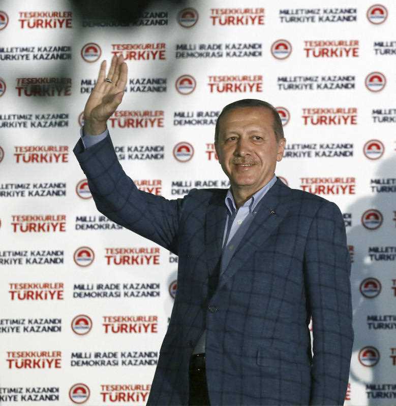 Turkish Prime Minister Recep Tayyip Erdogan acknowledges supporters after his election victory, in Ankara, Turkey, Sunday, Aug. 10, 2014.