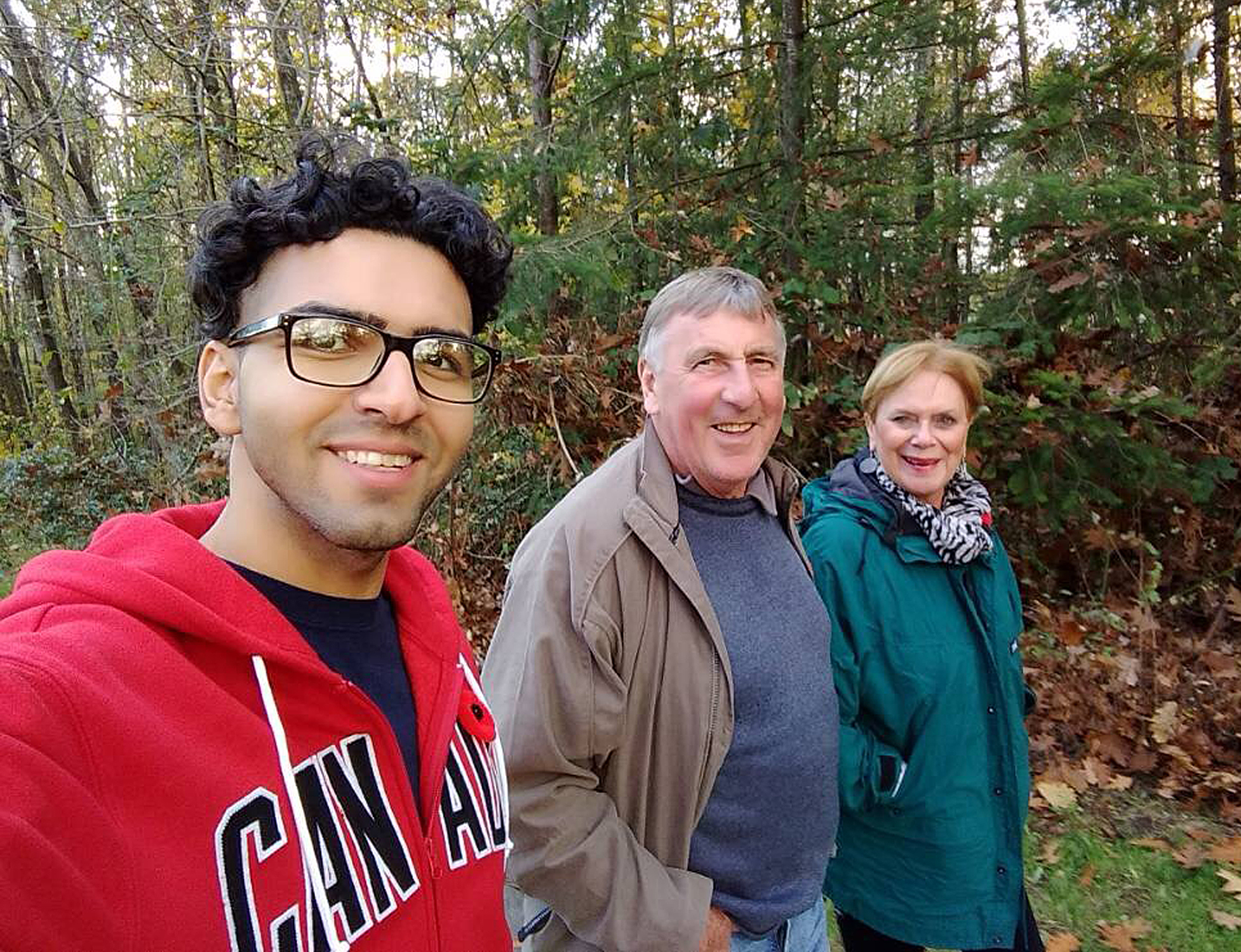 Amir Taghinia with the Taylor family in Canada who helped him resettle in Canada.