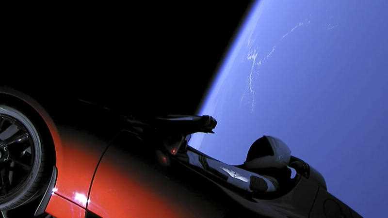 This image from video provided by SpaceX shows the company's spacesuit in Elon Musk's red Tesla sports car which was launched into space during the first test flight of the Falcon Heavy rocket on Tuesday, February 6, 2018.