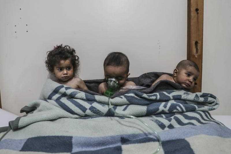 Affected children receive treatment after a gas attack on al-Shifunieh village, in Eastern Ghouta, Syria, 25 February 2018