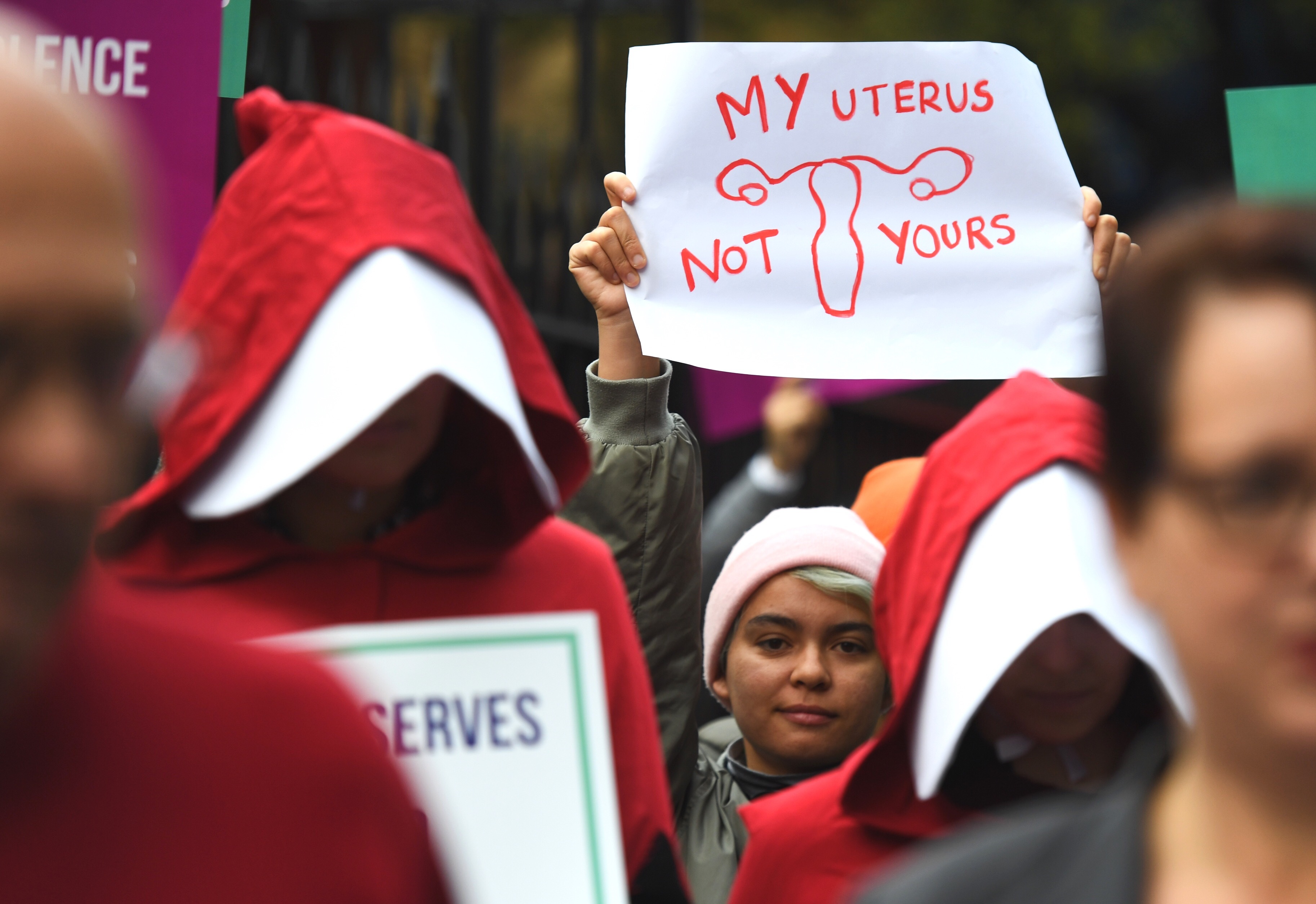 Supporters of creating a safe access zone around abortion clinics in NSW gather outside NSW Parliament House in Sydney, Thursday, June 7, 2018. 