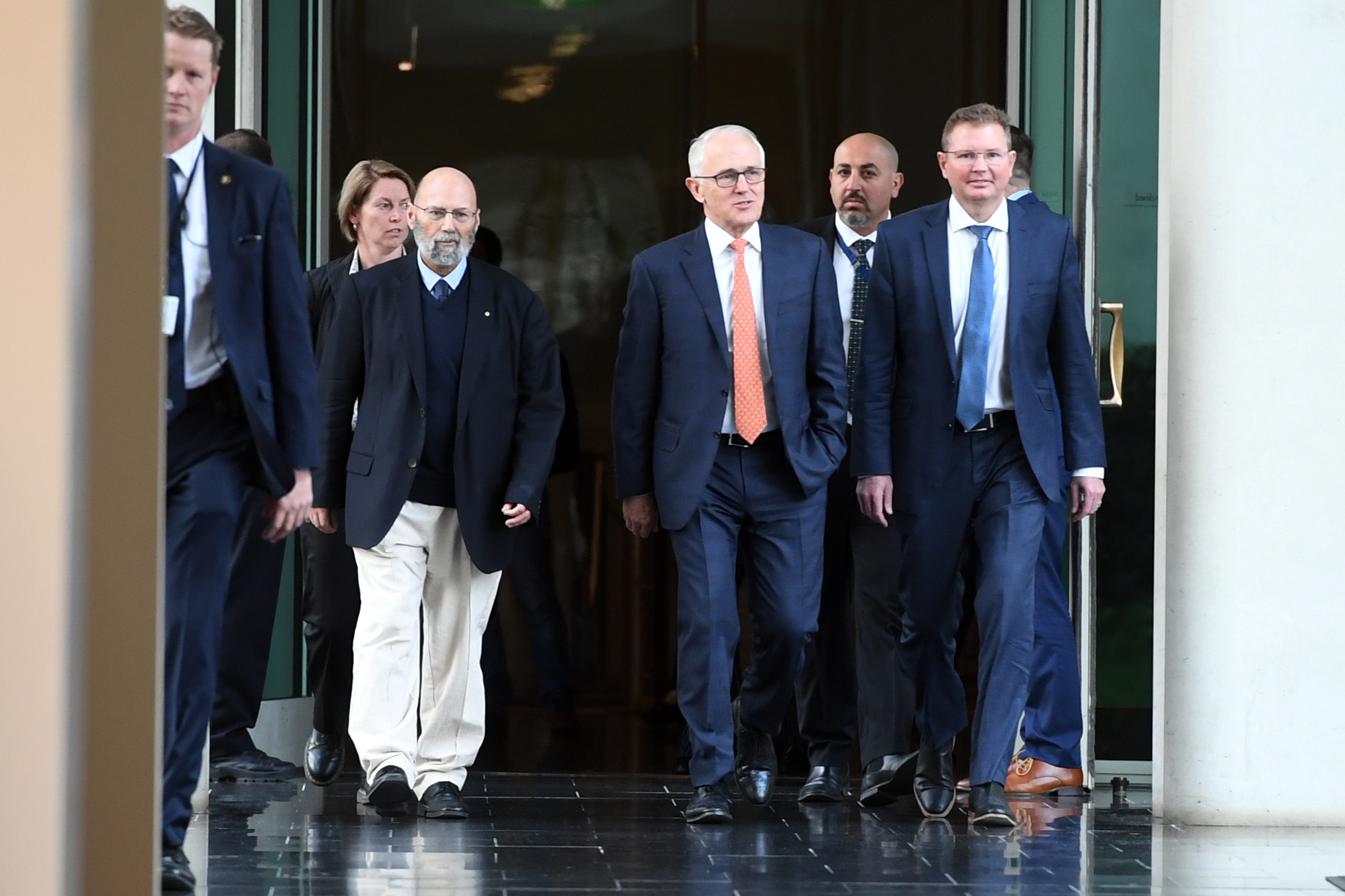 Malcolm Turnbull arrives with Arthur Sinodinos  and Craig Laundy for the Liberal Party room meeting at Parliament House in Canberra, Friday, August 24, 2018. 