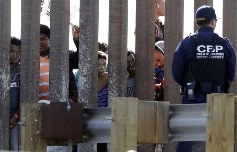 Central American migrants gather at the Us-Mexico border, after travelling thousands of kilometres. 