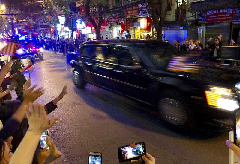 Donald Trump passes wellwishers in his car on his way to meet Kim Jong-un.