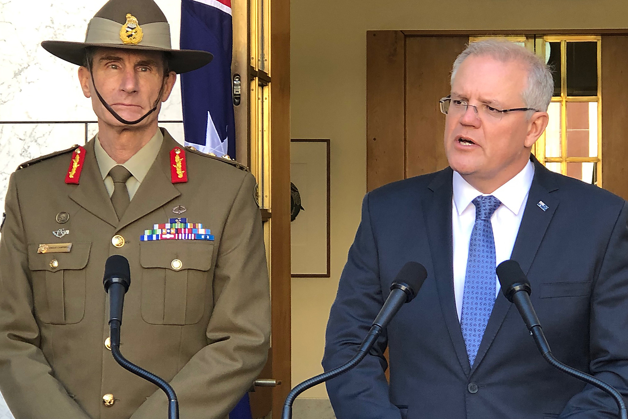 Prime Minister Scott Morrison (right) and Defence Force chief Angus Campbell announce Australia will send troops to the Strait of Hormuz.