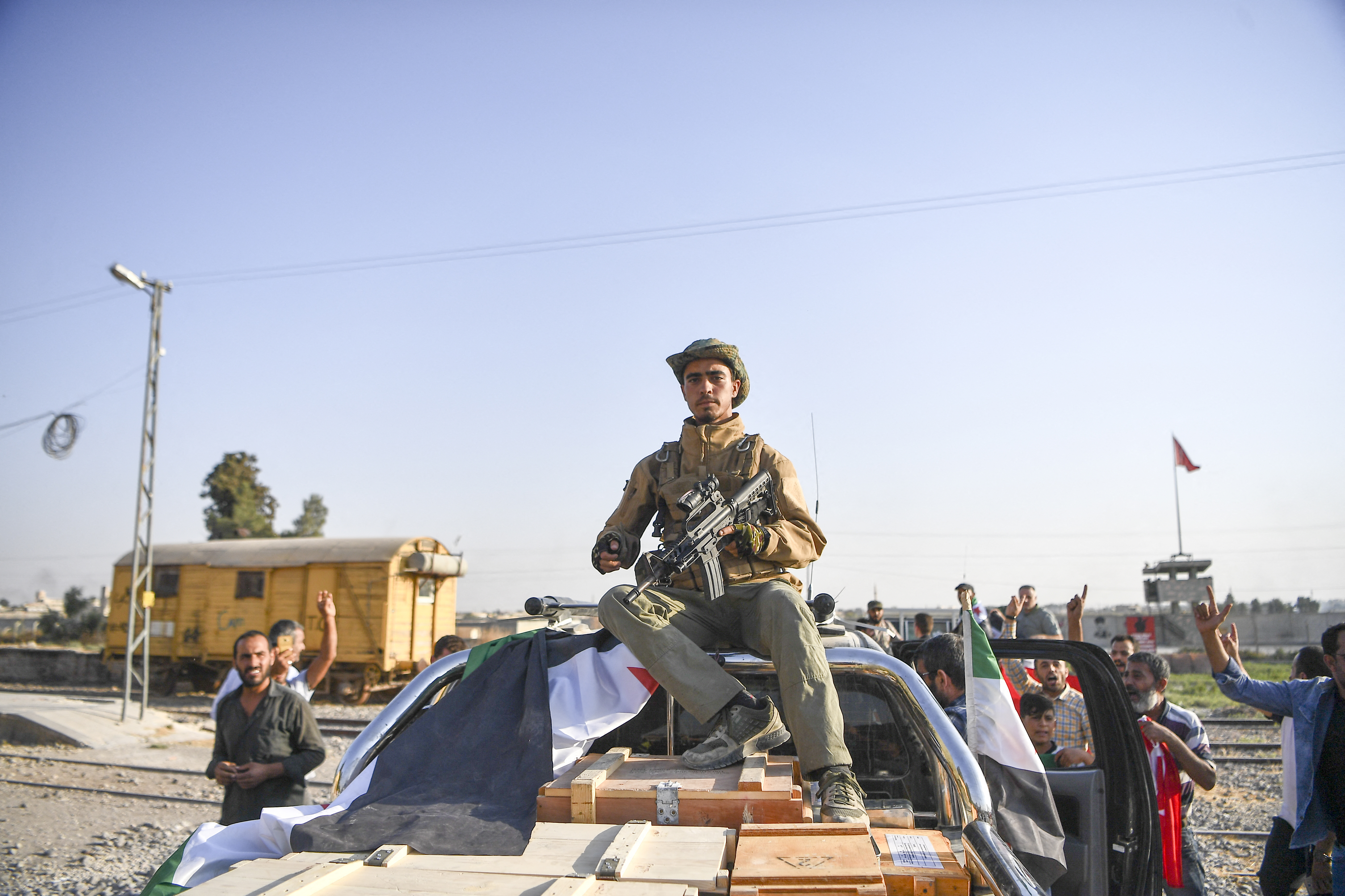 Fighters of Turkish-backed Free Syrian Army enter the town of Tal Abyad. 