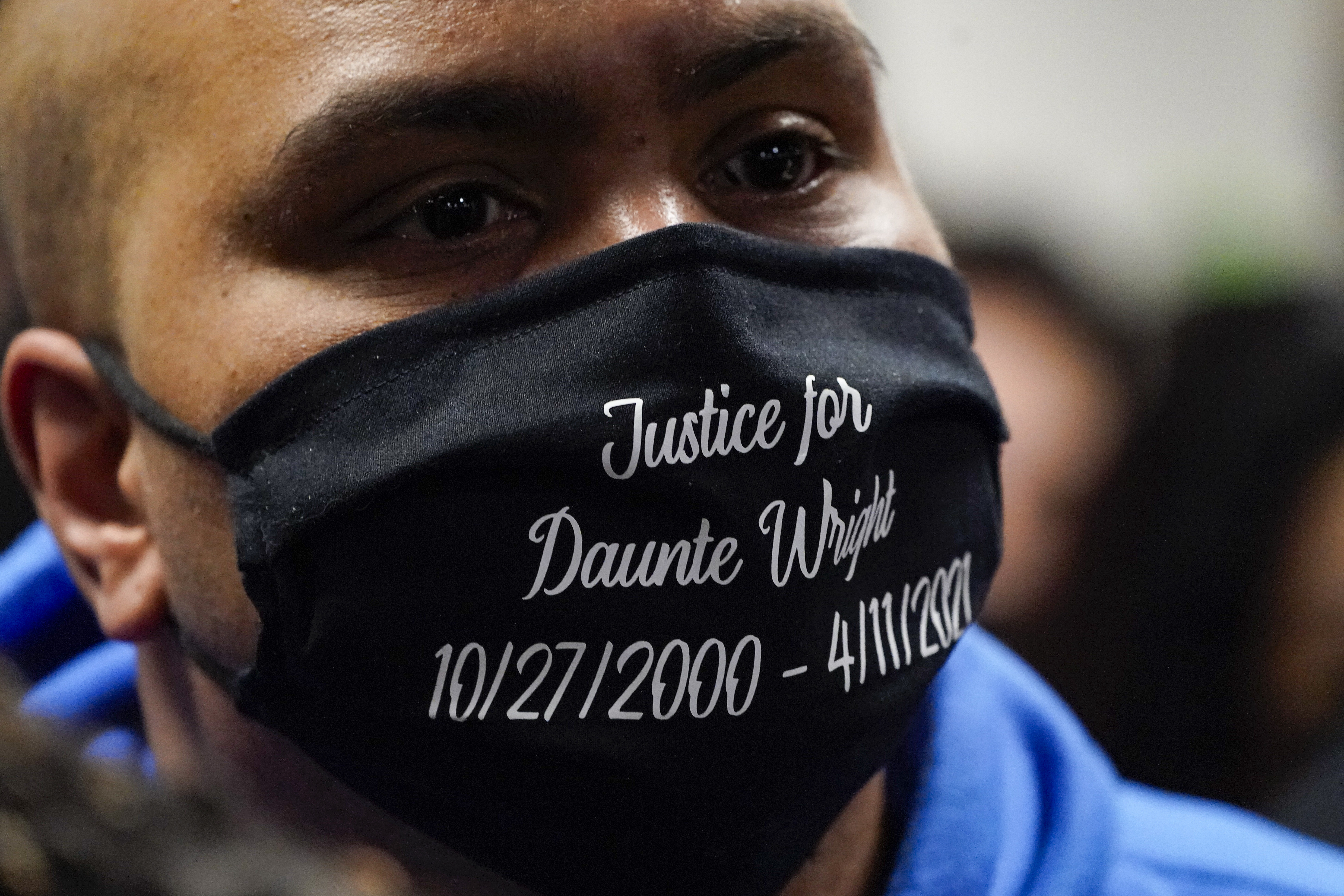 A mourner wears a mask  Daunte Wright during his funeral service at Shiloh Temple International Ministries in Minneapolis