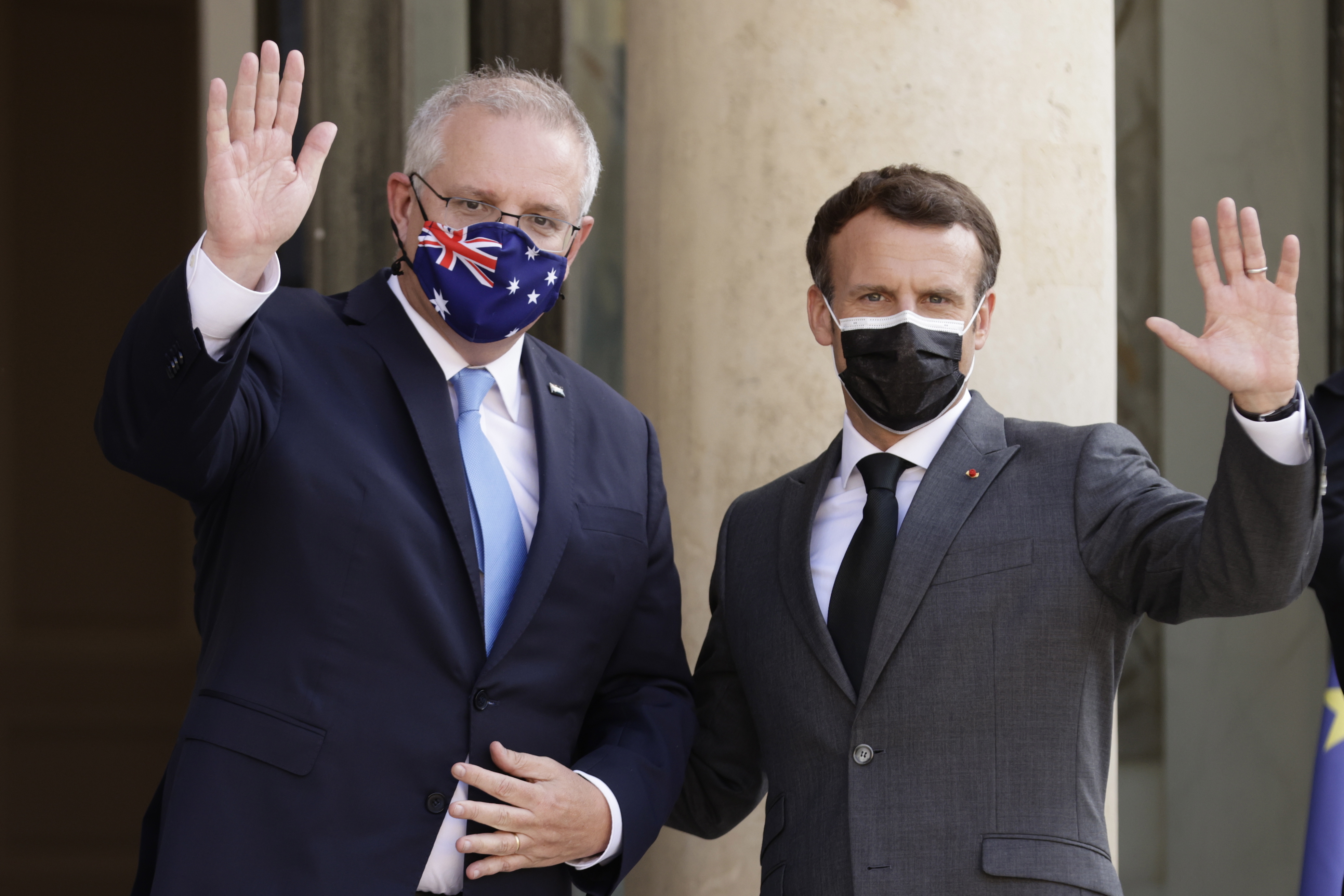 French President Emmanuel Macron greets Australian Prime Minister Scott Morrison upon his arrival at the Elysee Palace in Paris in June.