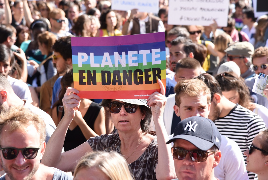 People in Paris join tens of thousands across the world who marched calling for action on climate change. 