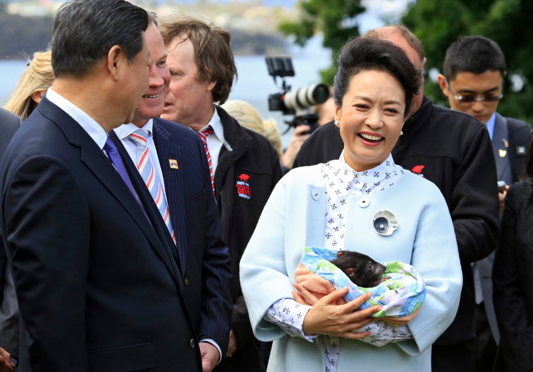 Cheeky devil: Chinese President Xi Jinping and wife Madame Peng Liyuan (AAP)