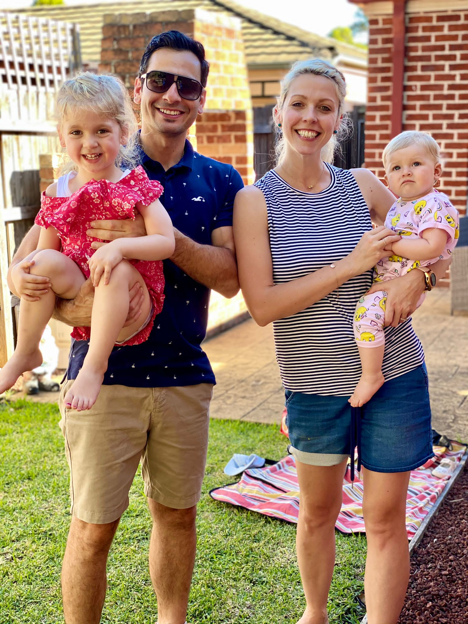 Anika Saad, her husband Sam and their two daughters.