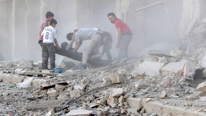 Casualties are evacuated after Syrian regime airstrikes hit Aleppo's opposition controlled Al-Ansari town, Syria