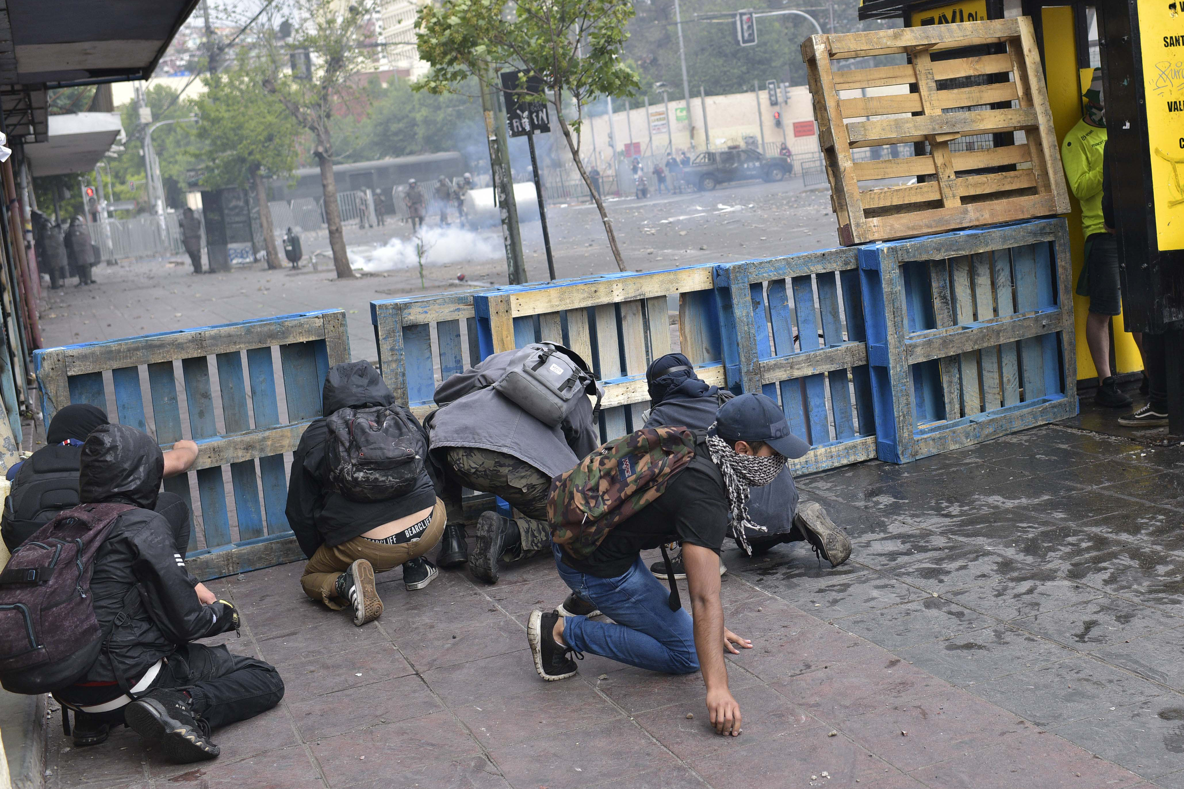 Demonstrators clash with security forces during a demonstration in Valparaiso, Chile.