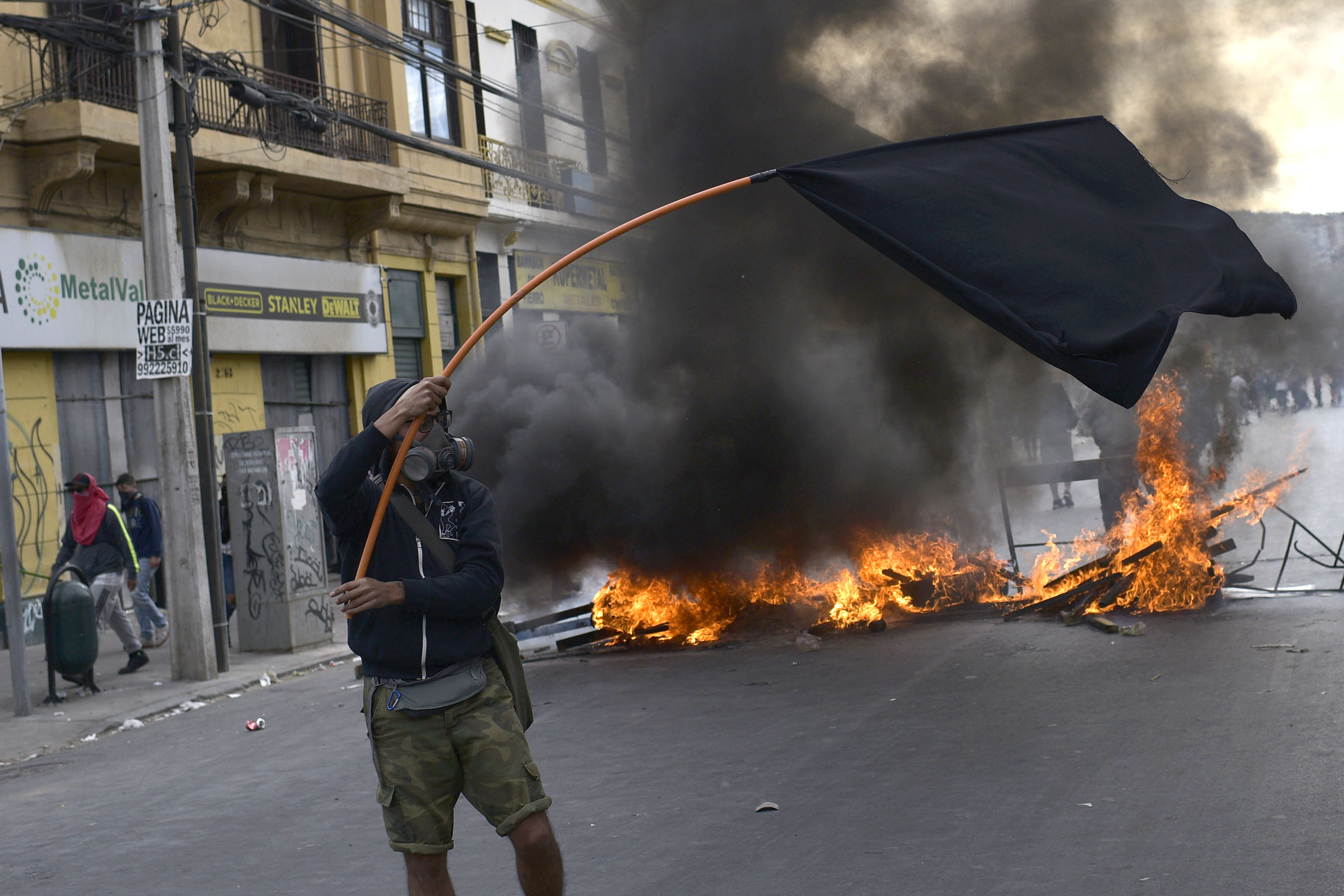 Demonstrators clash with security forces during a demonstration in Valparaiso, Chile.