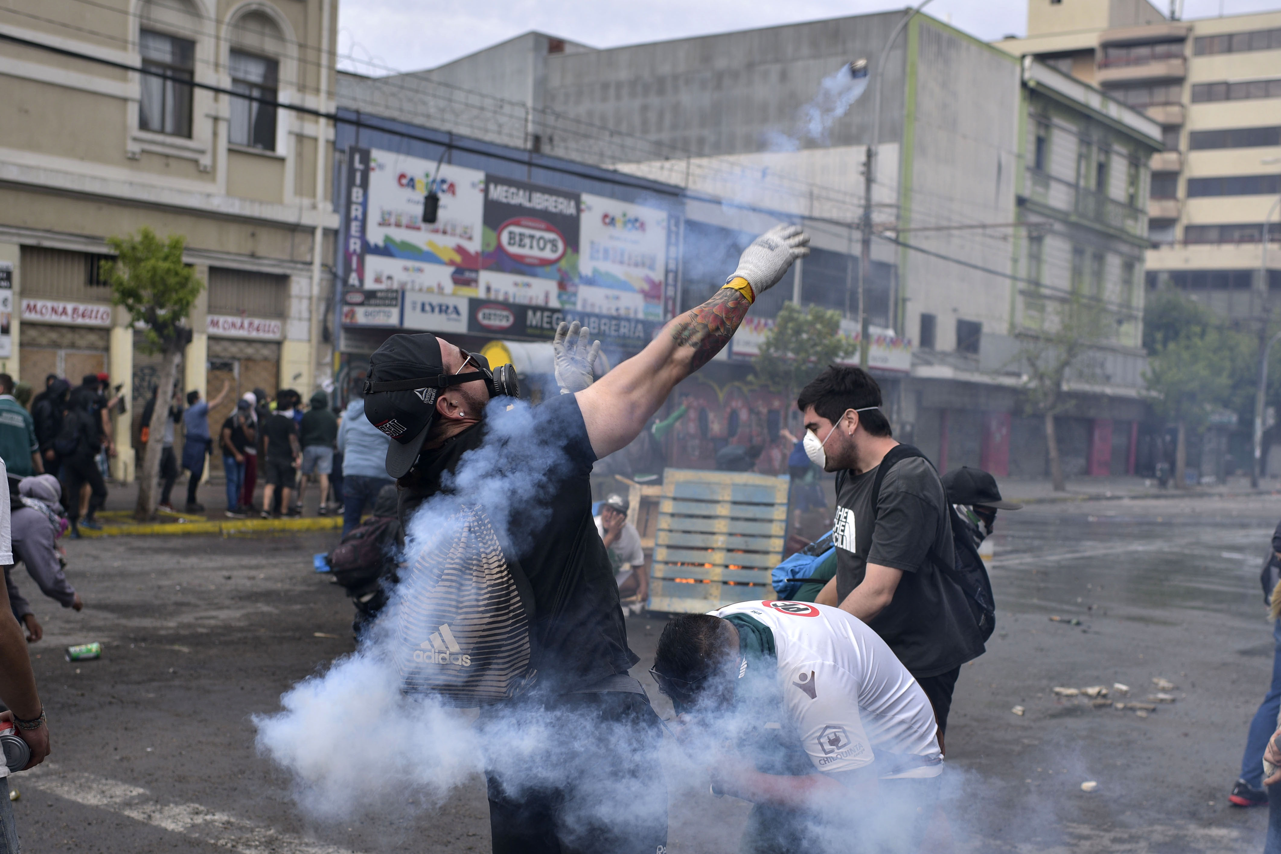 Demonstrators clash with security forces during a demonstration in Valparaiso, Chile.