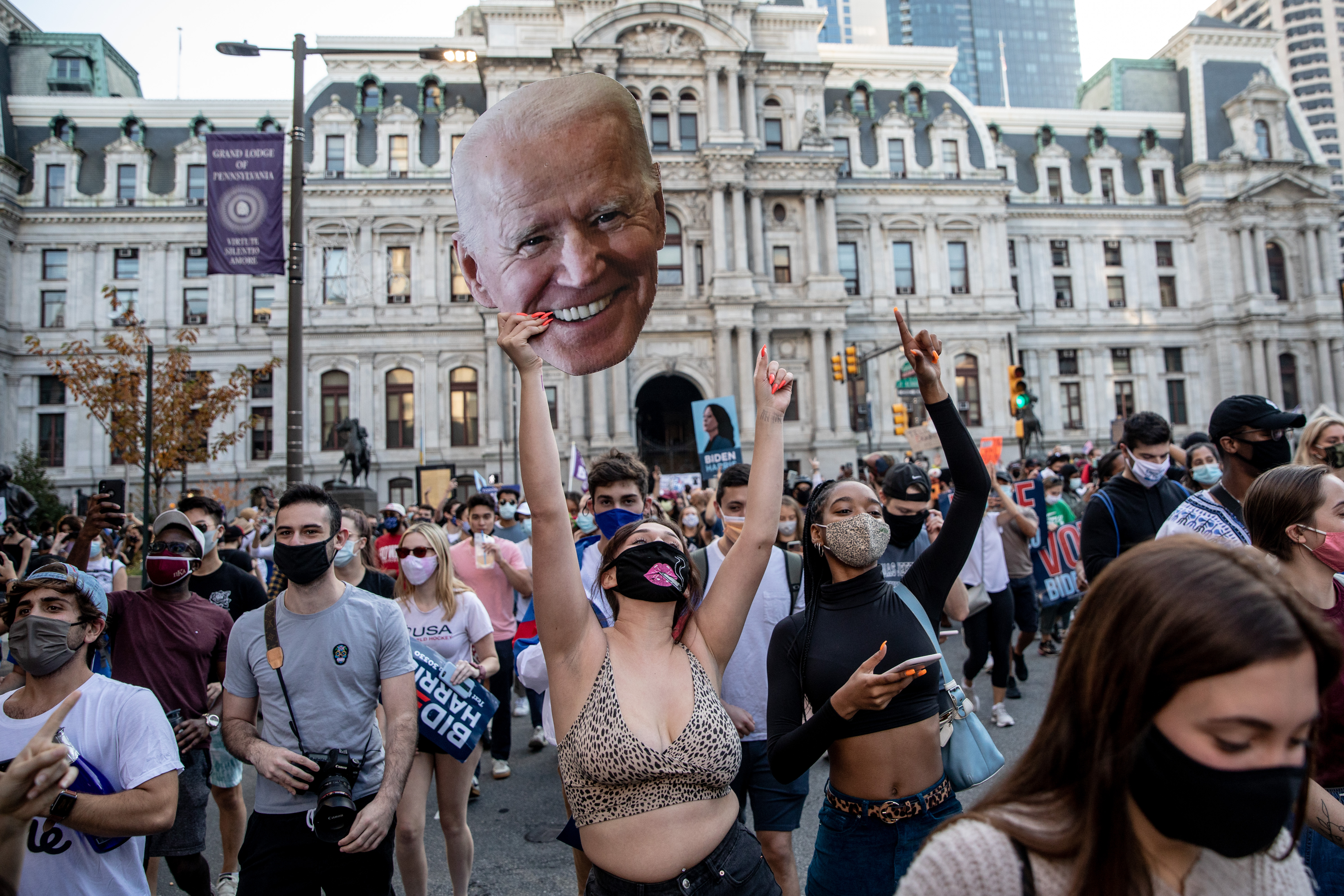 People celebrate outside Philadelphia City Hall after Joe Biden was declared winner of the 2020 presidential election. 