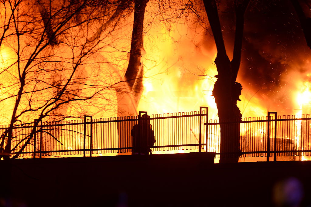  A firefighter tries to put out a fire as Turkish army busses burn after an explosion on February 17, 2016 in Ankara, Turkey.