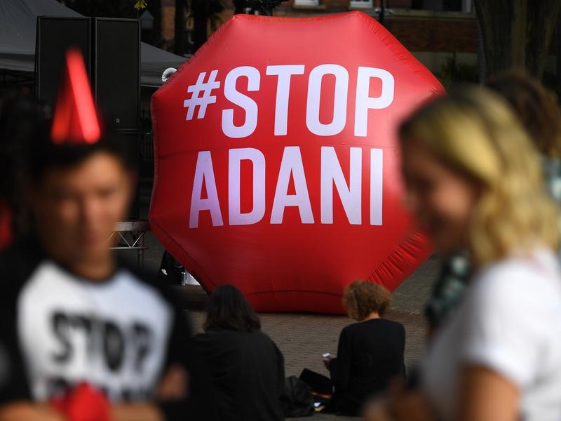 A new poll shows Queenslanders and Victorians agree on climate change, despite Adani mine conflicts.