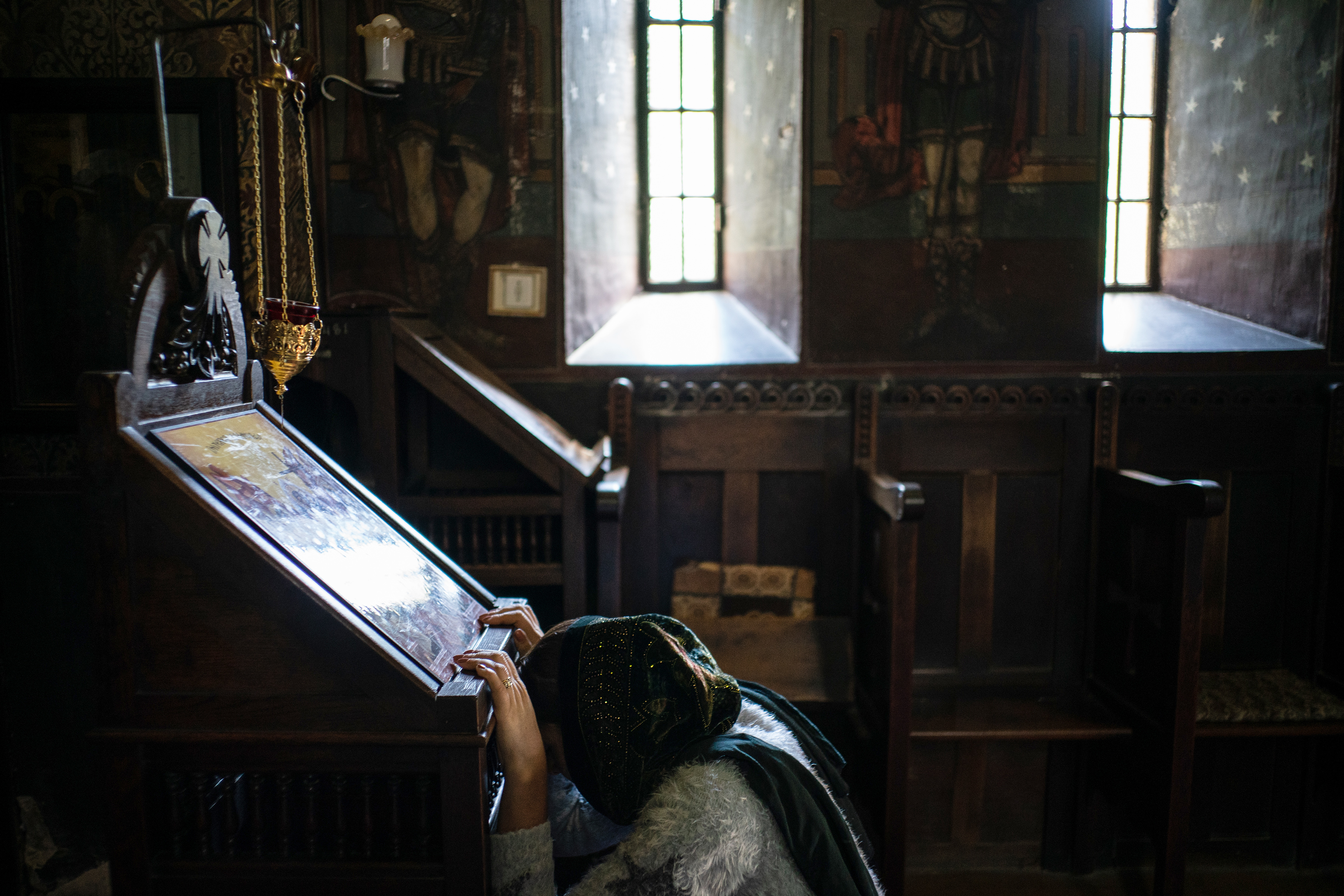 Florentina Mutu prays at a monastery near Olteni, Romania.