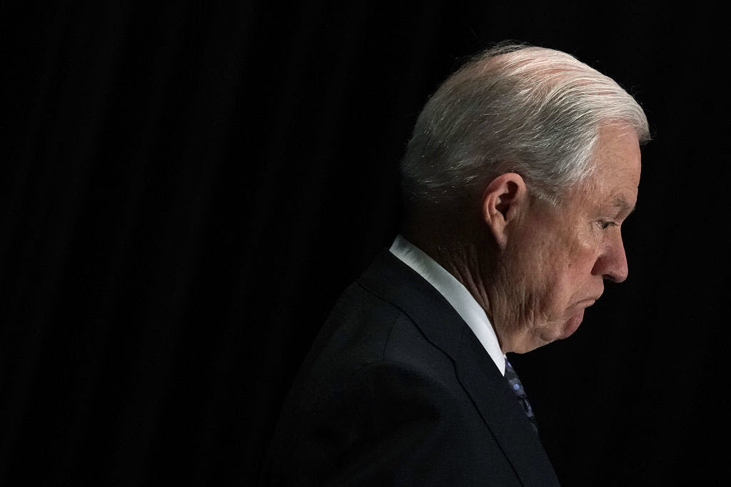 Attorney General Jeff Sessions listens as he is introduced