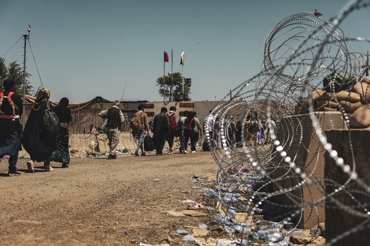 Evacuees wait to be processed at Hamid Karzai International Airport on 25 August 2021.