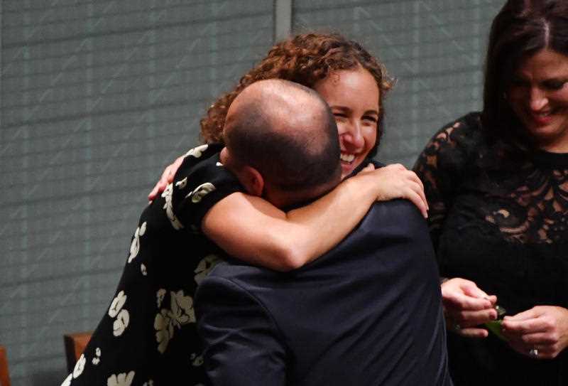 Mr Frydenberg is hugged by wife Amie after handing down his first Federal Budget in the House of Representatives.