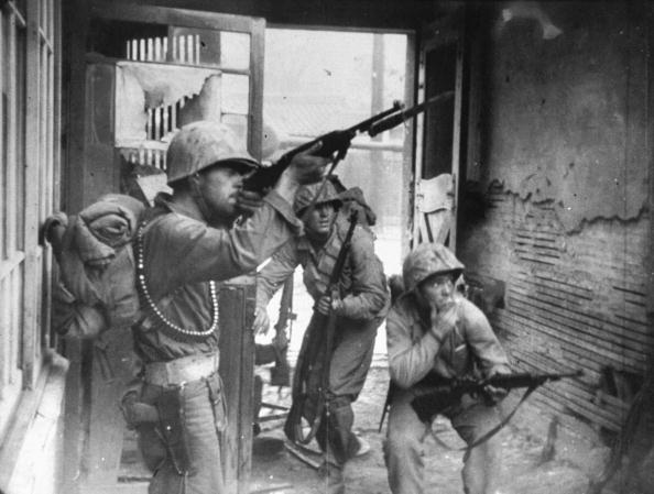 American soldier during urban combat during the Korean War. 