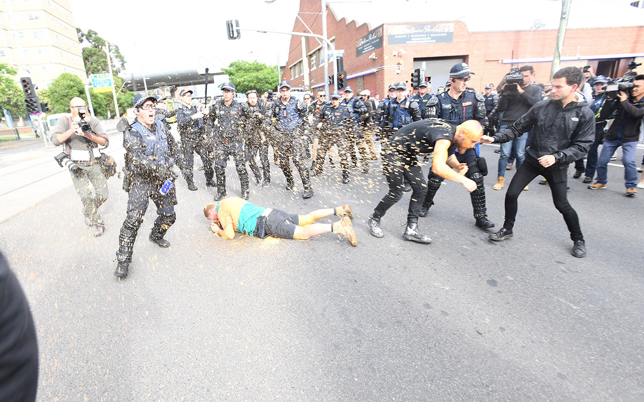 Protesters clash police in Kensington, Melbourne on Monday, December 4, 2017.