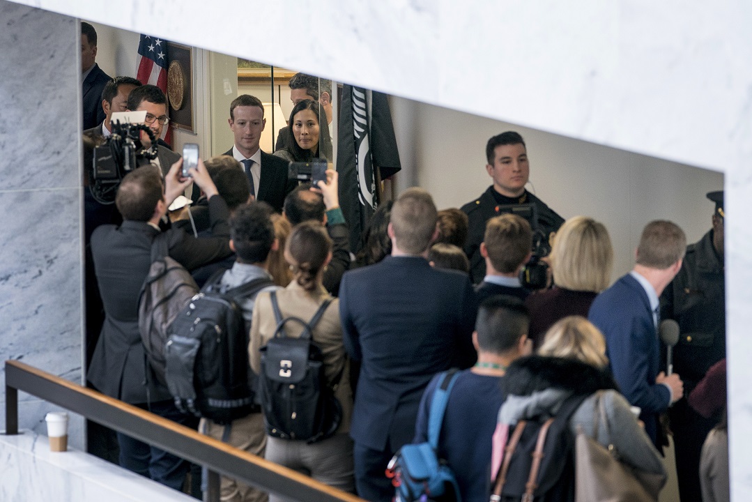 Facebook CEO Mark Zuckerberg and his wife Priscilla Chan, top center left, leave a meeting with Senator Bill Nelson.