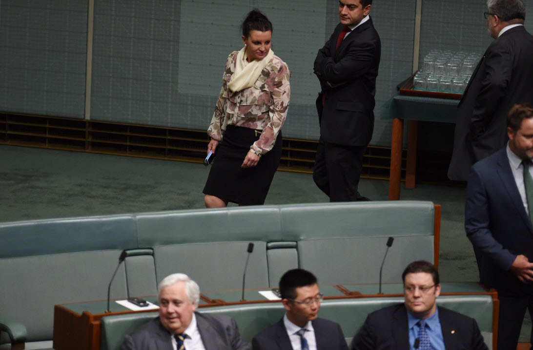If looks could kill: Jacqui Lambie passes her party colleagues (AAP)