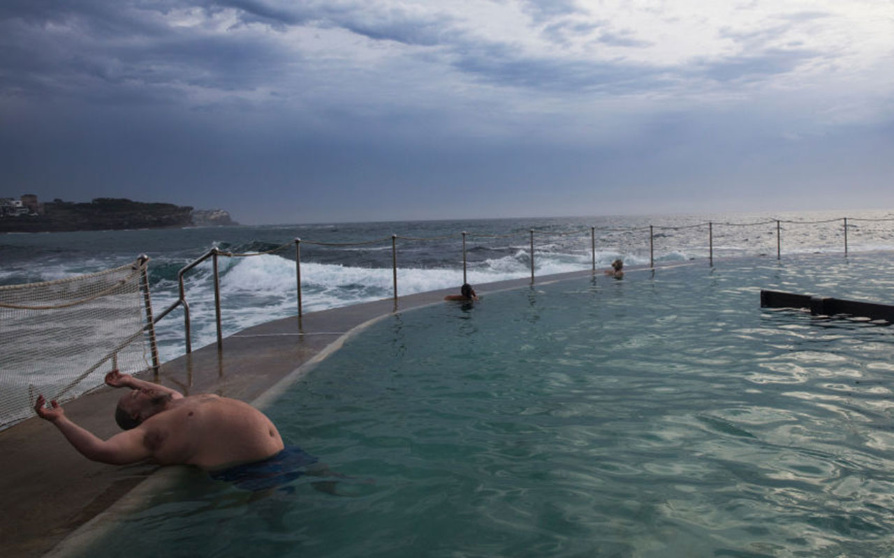 A man stretches himself while taking a swim in the ocean pool at Bronte Beach on December 16, 2017 in Sydney, Australia.