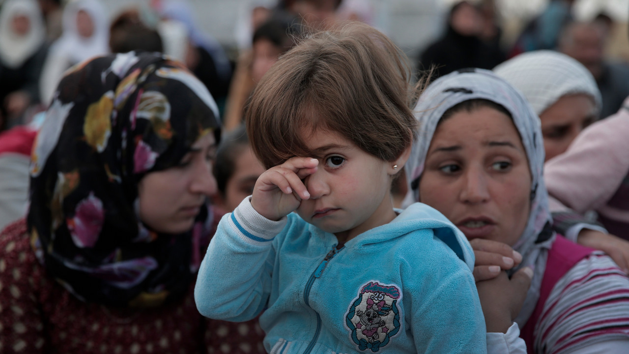 Kurdish mourners gather for the funeral of five Kurdish fighters, killed in the fighting with the militants of the IS group in Kobani in October 2014.