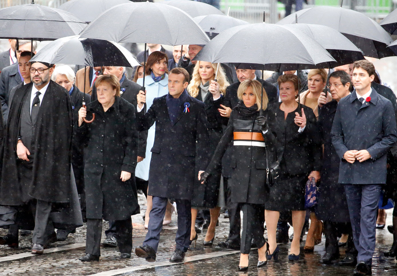(L-R) Prince Moulay El Hassan, King of Marocco Mohammed VI, German Chancellor Angela Merkel, French President Emmanuel Macron, his wife Brigitte Macron and Canada's Prime Minister Justin Trudeau arrive to attend the international ceremony of the Armistic