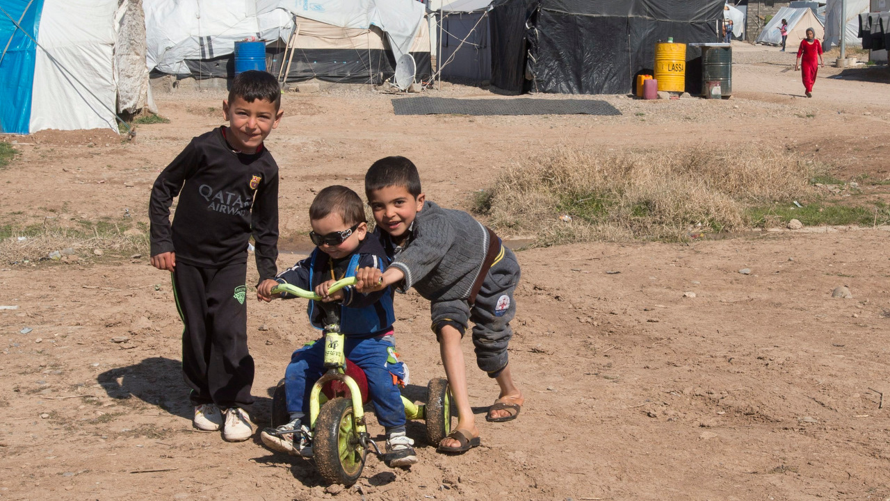 A group of Yazidi boys play at a camp for internal displaced persons, in Dohuk, Iraq.