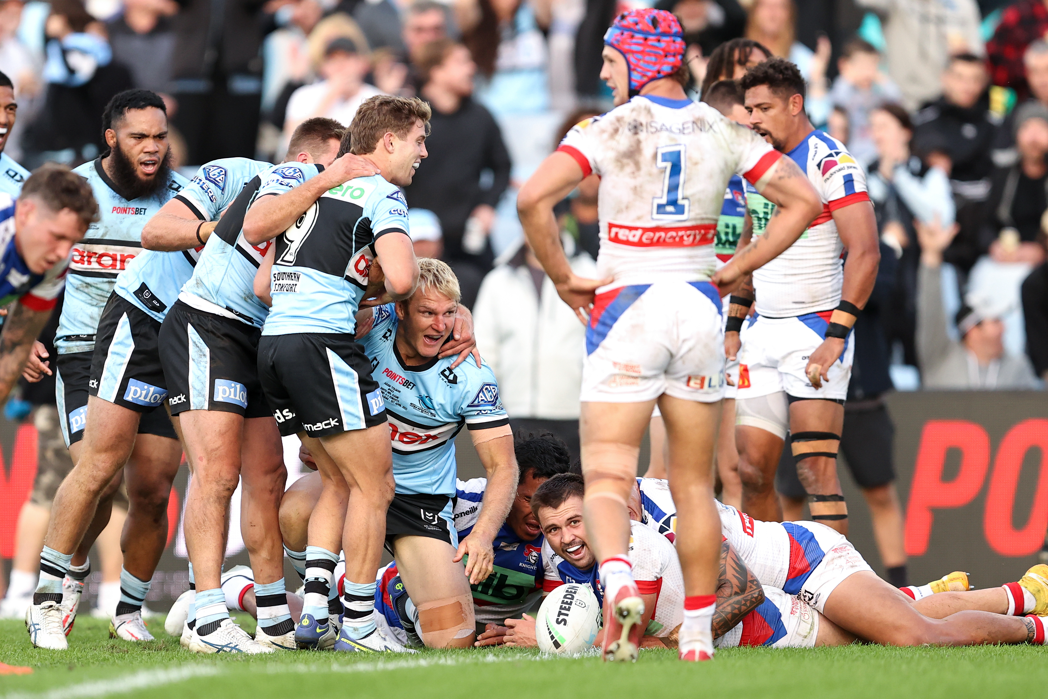 Aiden Tolman of the Sharks scores a try during the NRL Round 4 match between Cronulla Sharks and Newcastle Knights at Pointsbet Stadium in Sydney, Friday, April 1, 2022. (AAP Image/Brendon Thorne) NO ARCHIVING, EDITORIAL USE ONLY