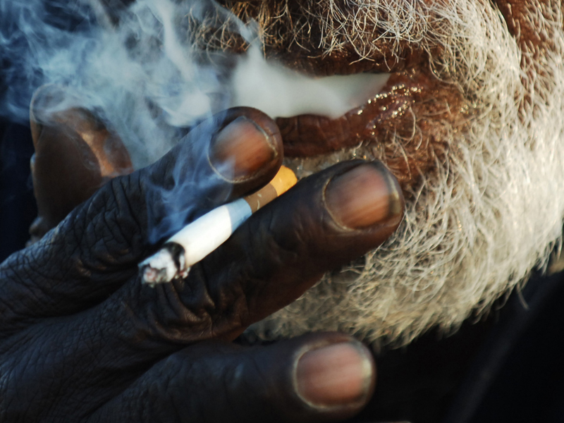 Aboriginal man smoking a cigarette