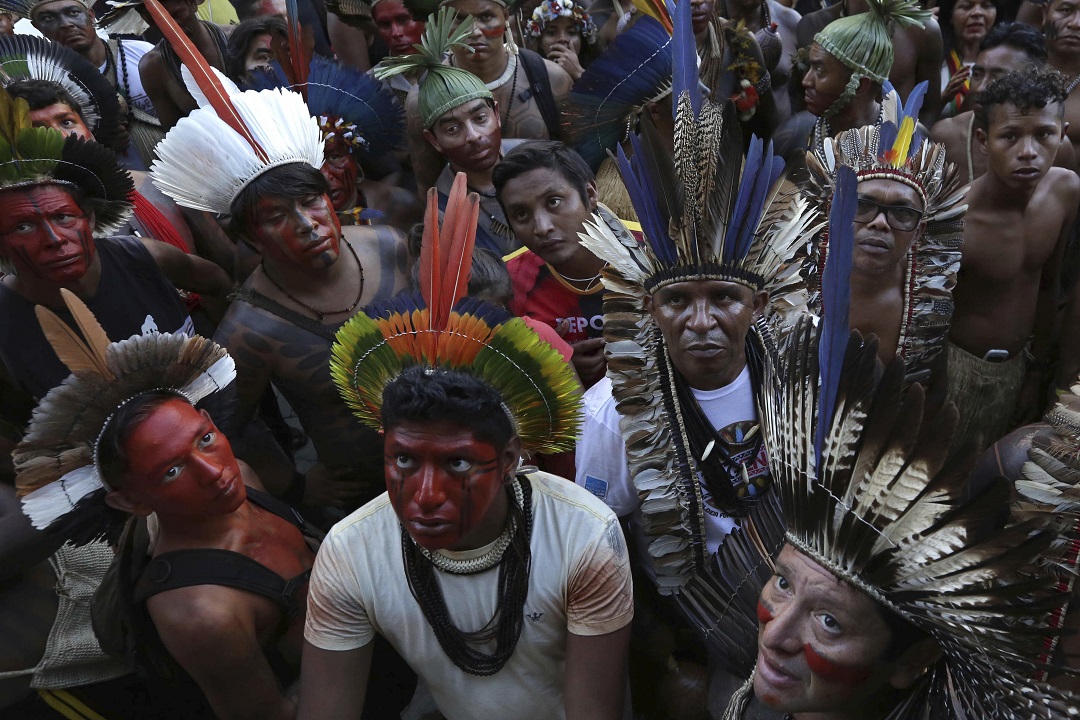 Indigenous groups holding a land rights protest in Brazil.