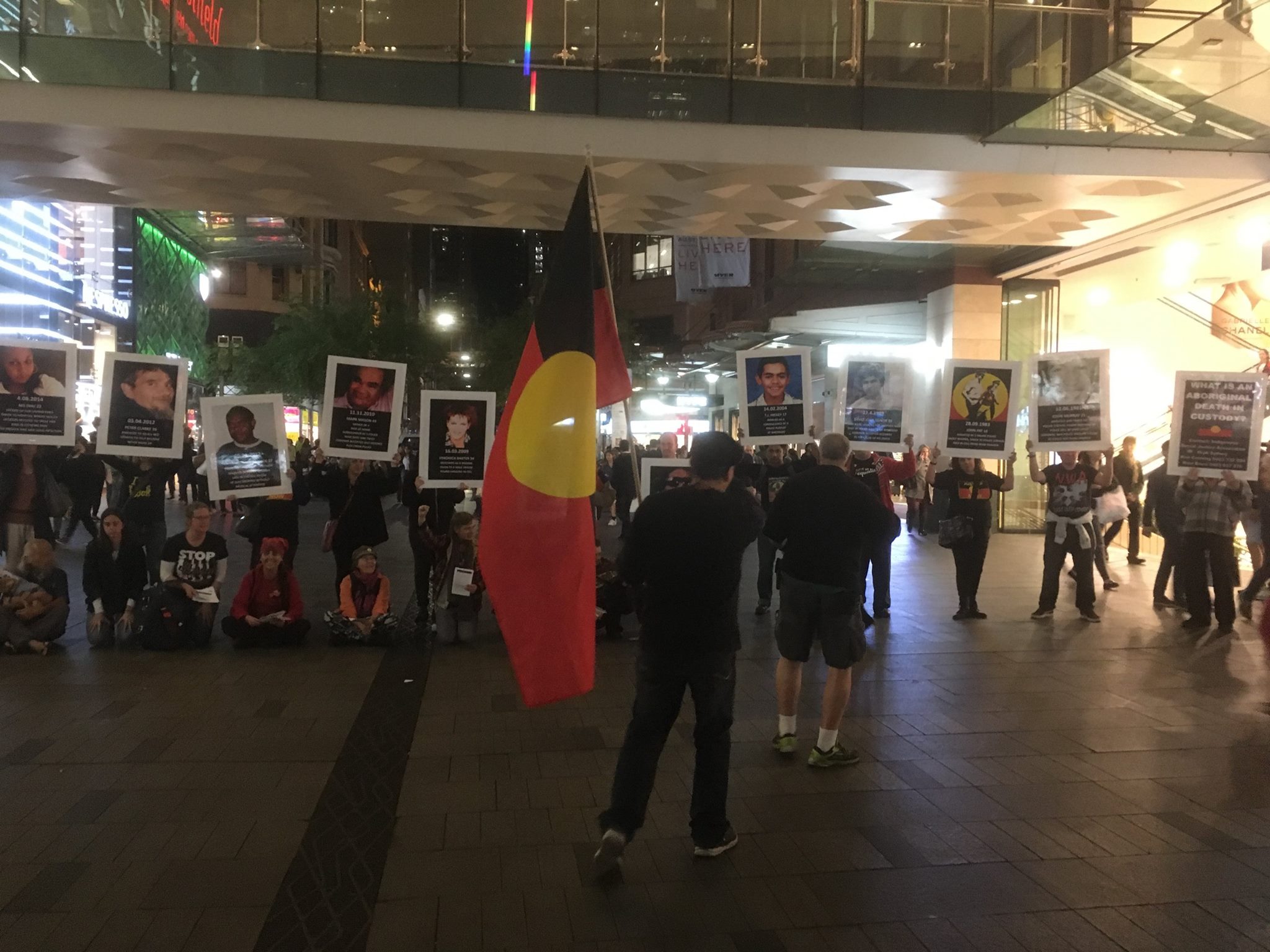 Uncle Ken Canning out front of a FIRE group bringing attention to the continued genocide through deaths in custody