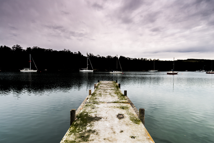 Concrete Jetty with Sailing Yachts in the Background