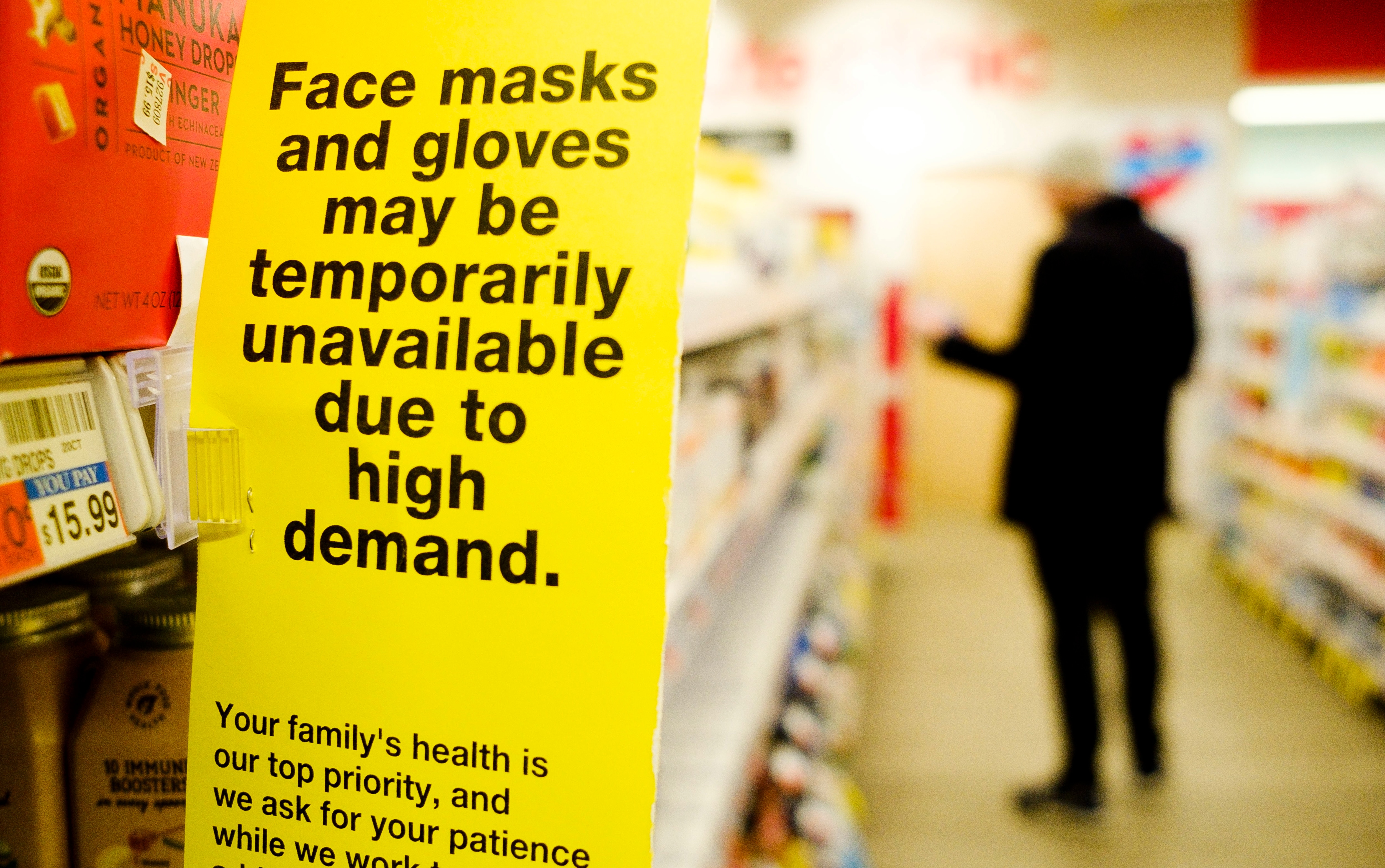 epa08272995 A sign about the supply of face masks and gloves hangs at a pharmacy near Times Square in New York, New York, USA, 05 March 2020. There are reportedly 22 confirmed cases of the coronavirus in New York. EPA/JUSTIN LANE