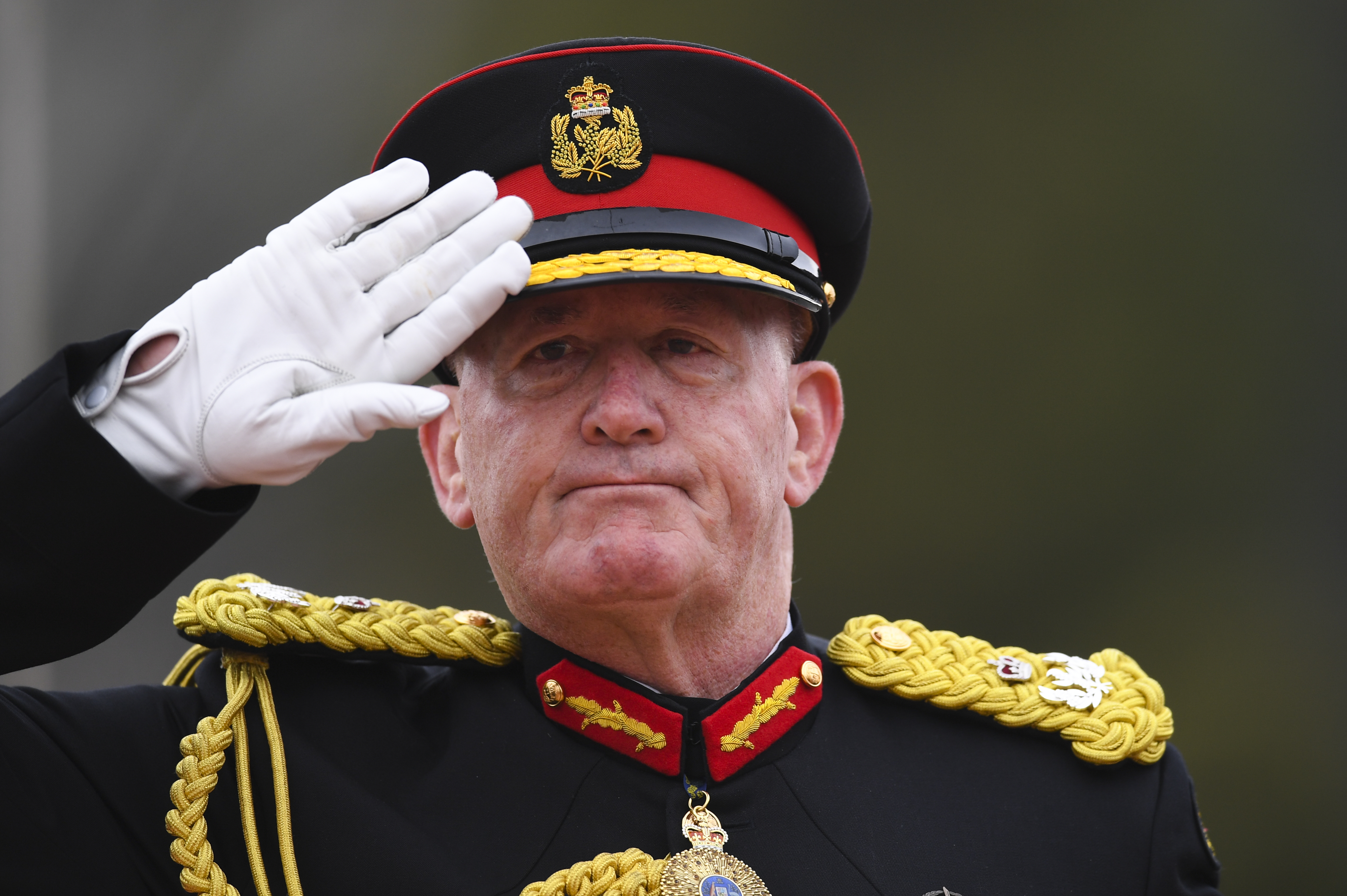 Australian Governor-General Sir Peter Cosgrove salutes during the Queens Birthday Parade for the 'Trooping of the Queens Colour' at the Royal Military College, Duntroon in Canberra, Saturday, June 8, 2019. The parade is the final public appearance in mili